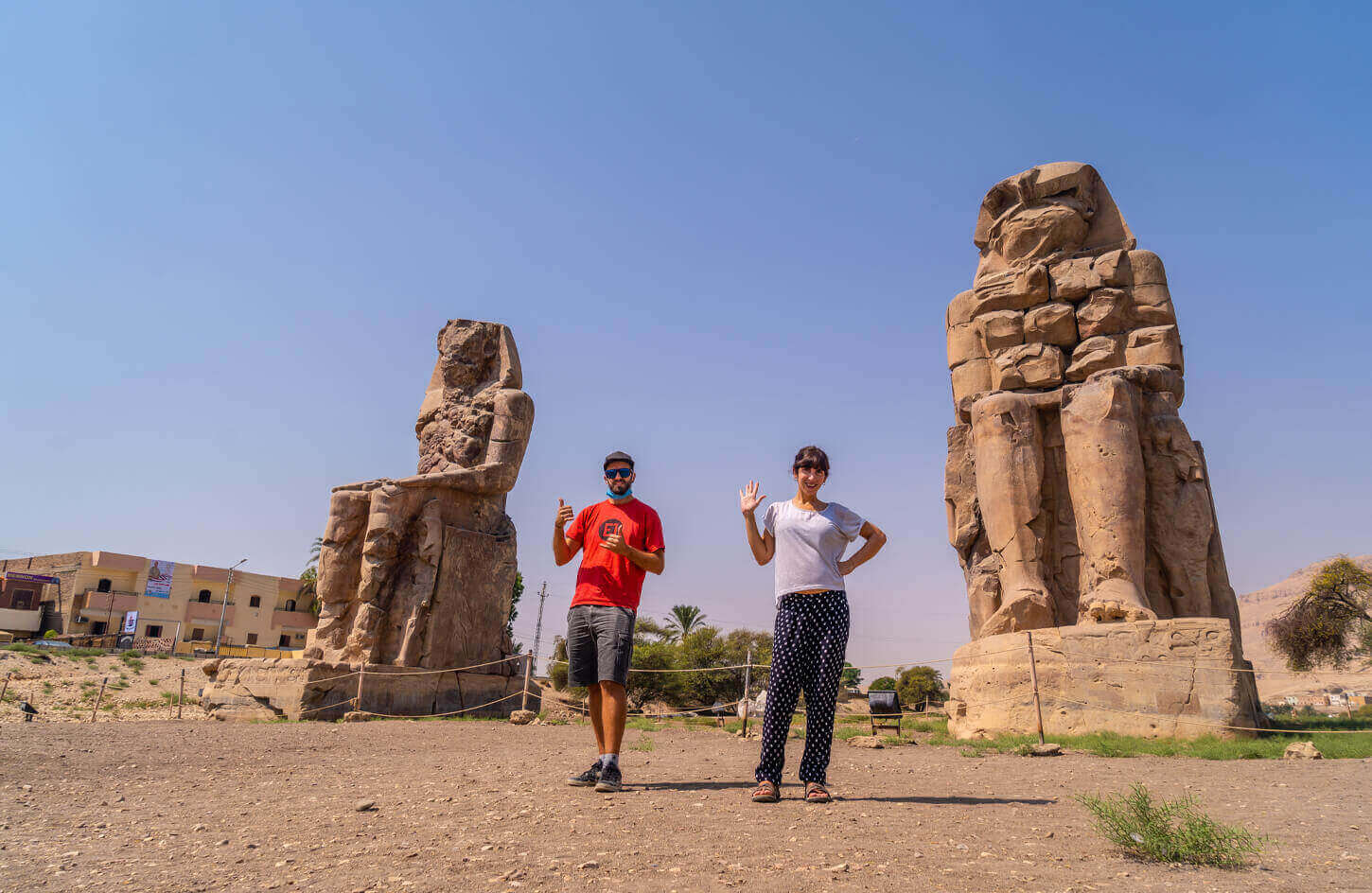 A couple from their visit to the two statues of Memnon in Luxor