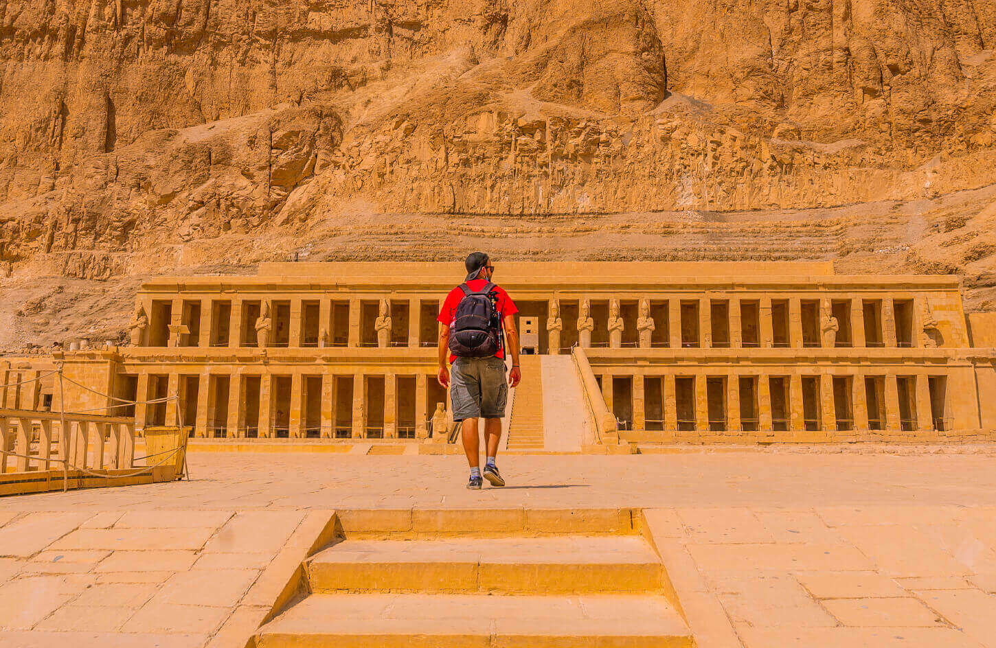 A visitor entering the Temple of Hatshepsut