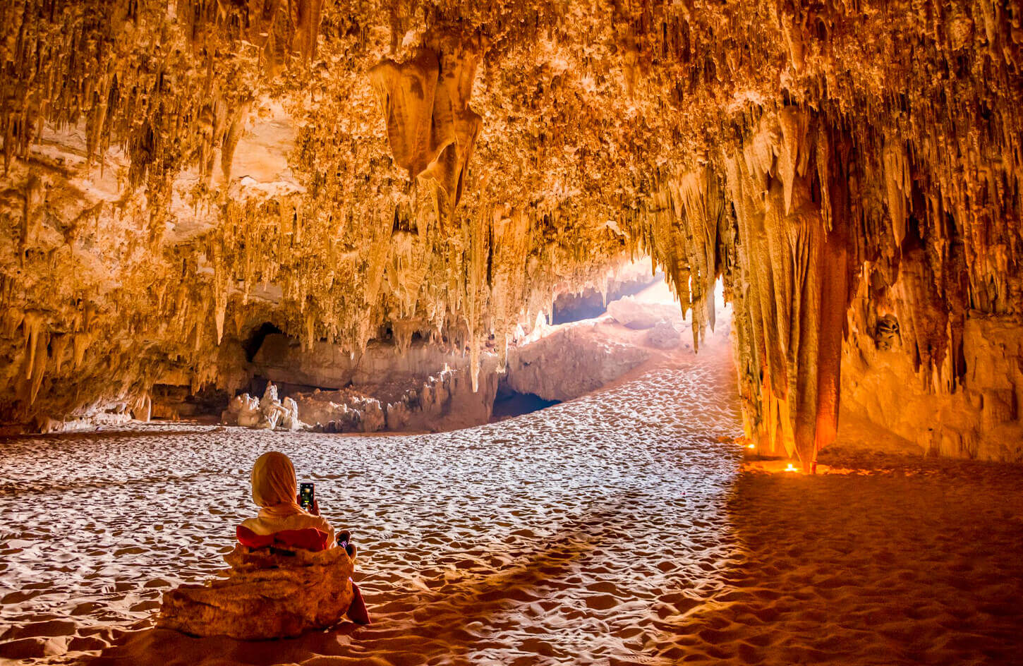 A girl from the inside of the Djara cave in the Bahariya oasis