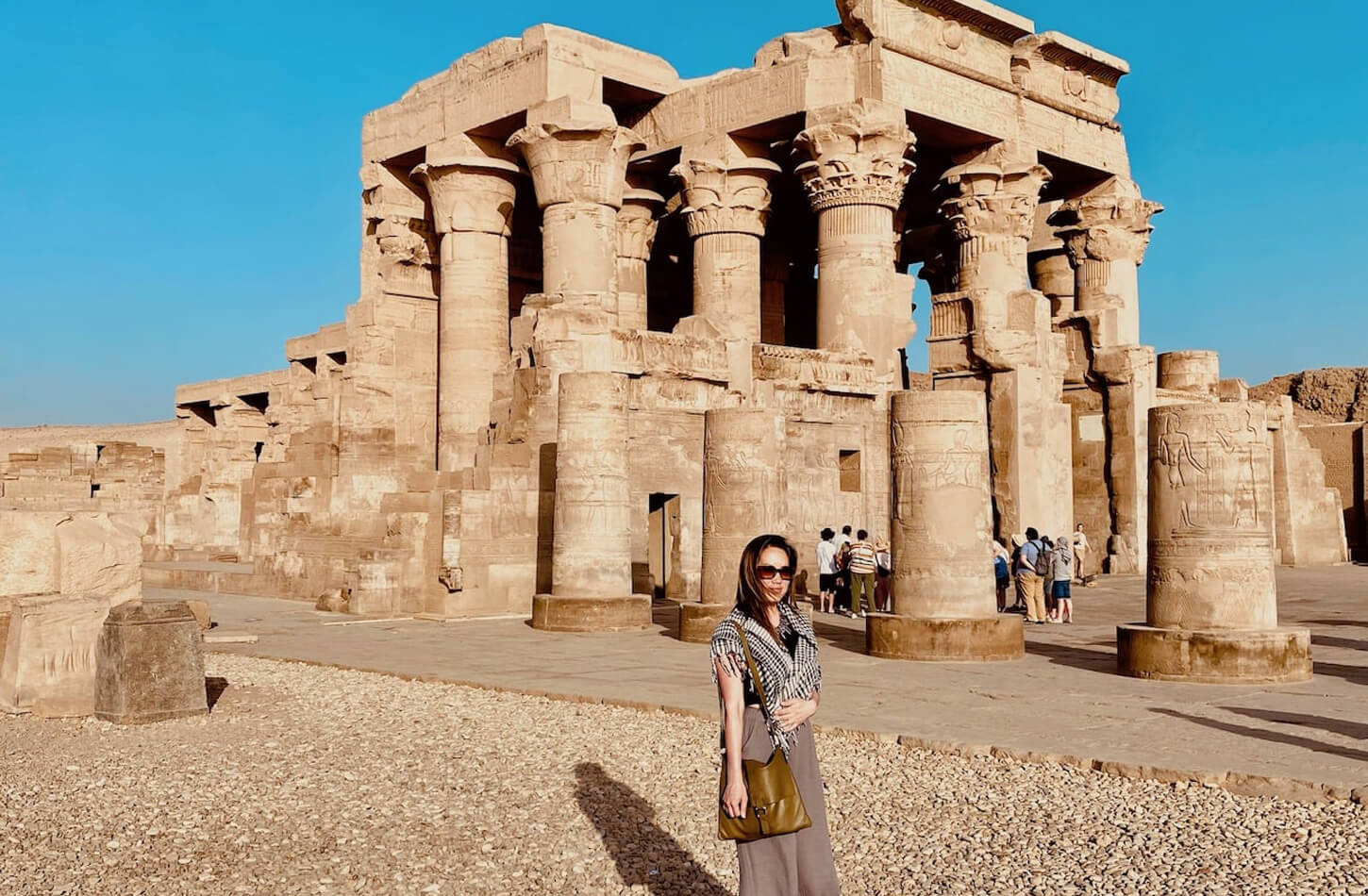 A woman in front of the Temple of Kombu