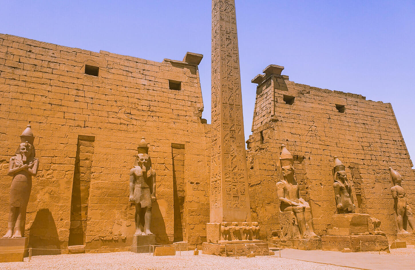 Statues and obelisk at the entrance to Luxor Temple