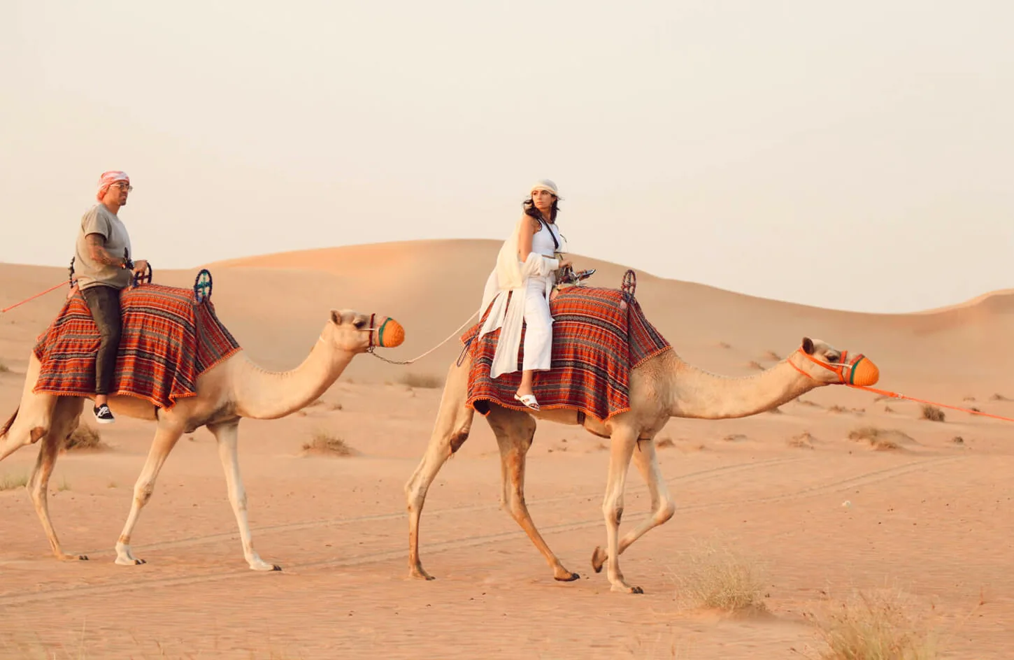 Some tourists riding camels on a safari in Hurghada