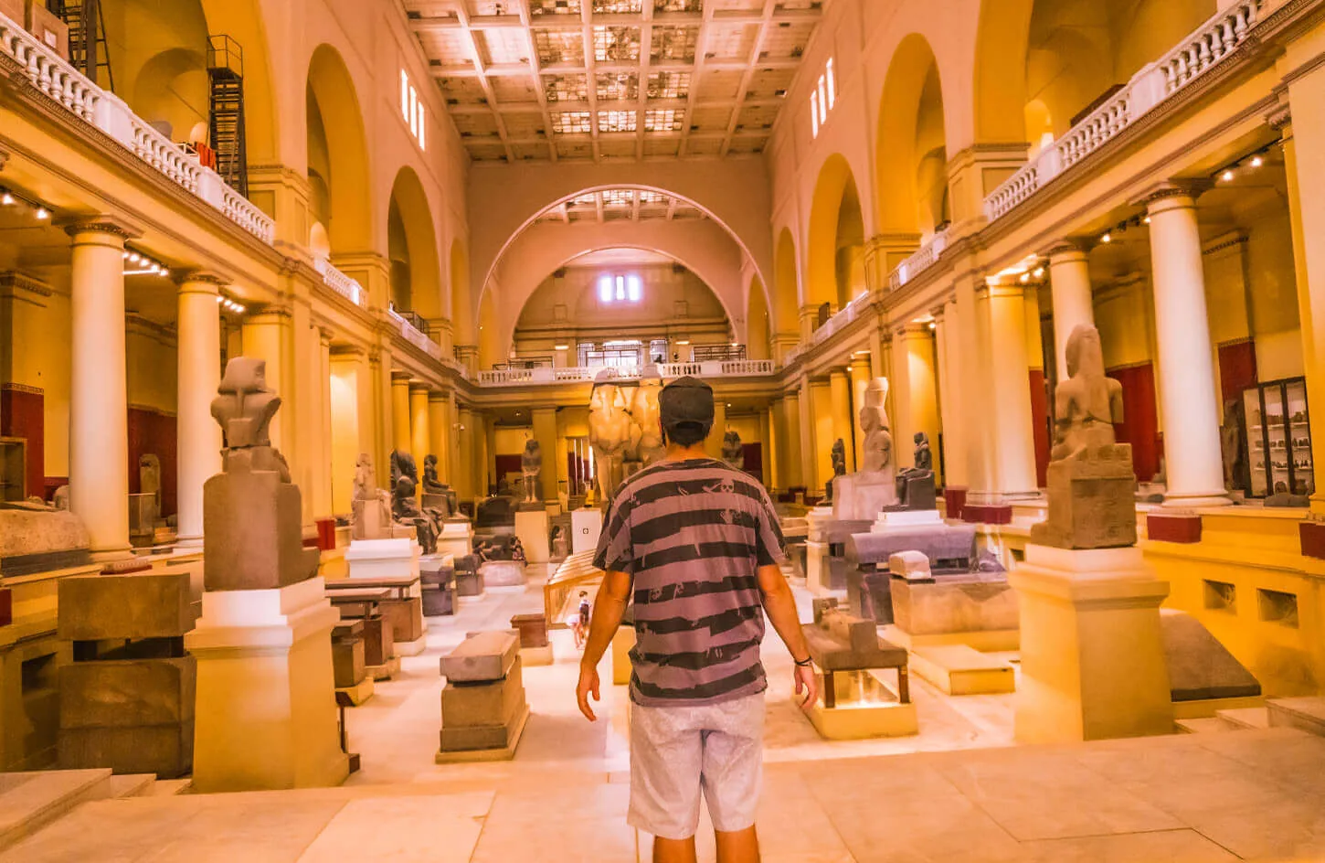 A visitor in the first hall of the Egyptian Museum