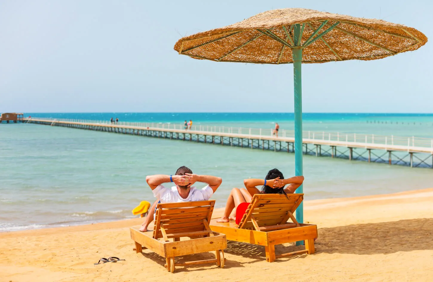 A couple sitting on one of the beaches of the Red Sea
