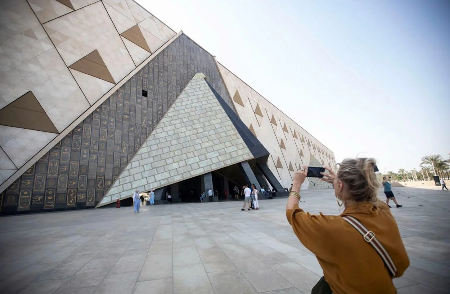 Woman in front of the Grand Egyptian Museum
