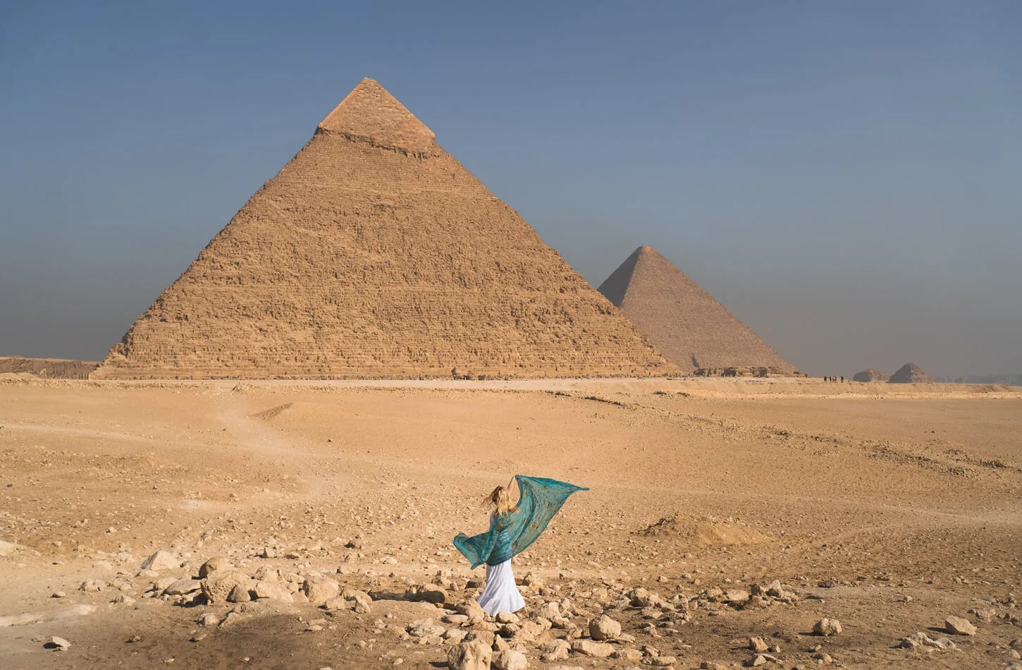 Woman standing in front of the Great Pyramid of Khufu