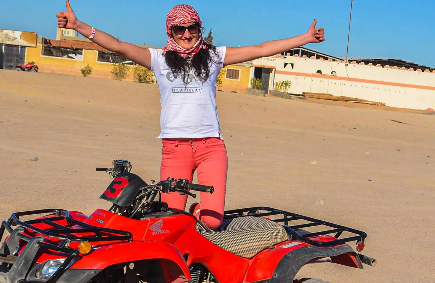 A girl getting ready to ride a quad bike