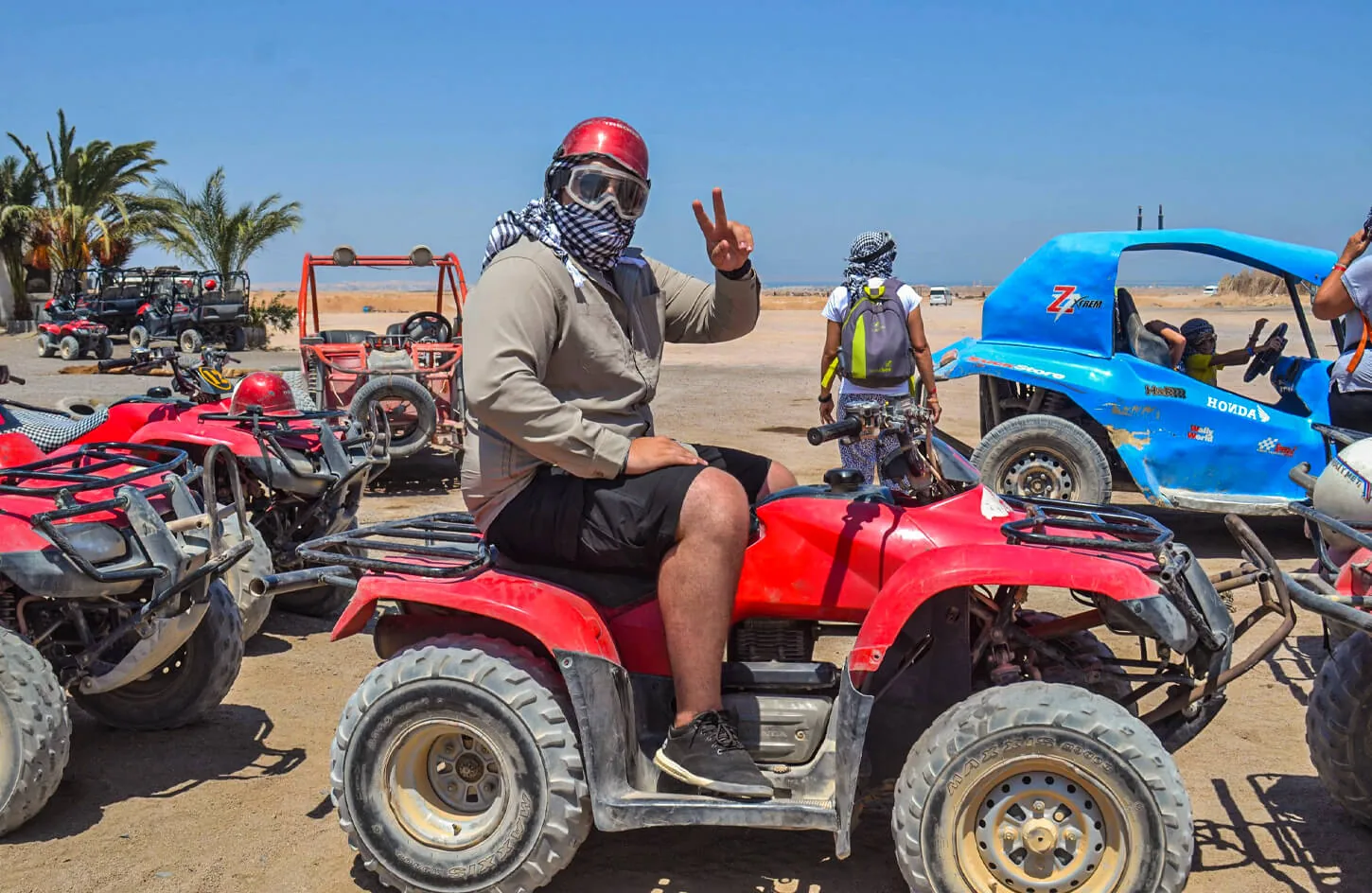 A person riding a quad bike from one of the safari trips in Hurghada