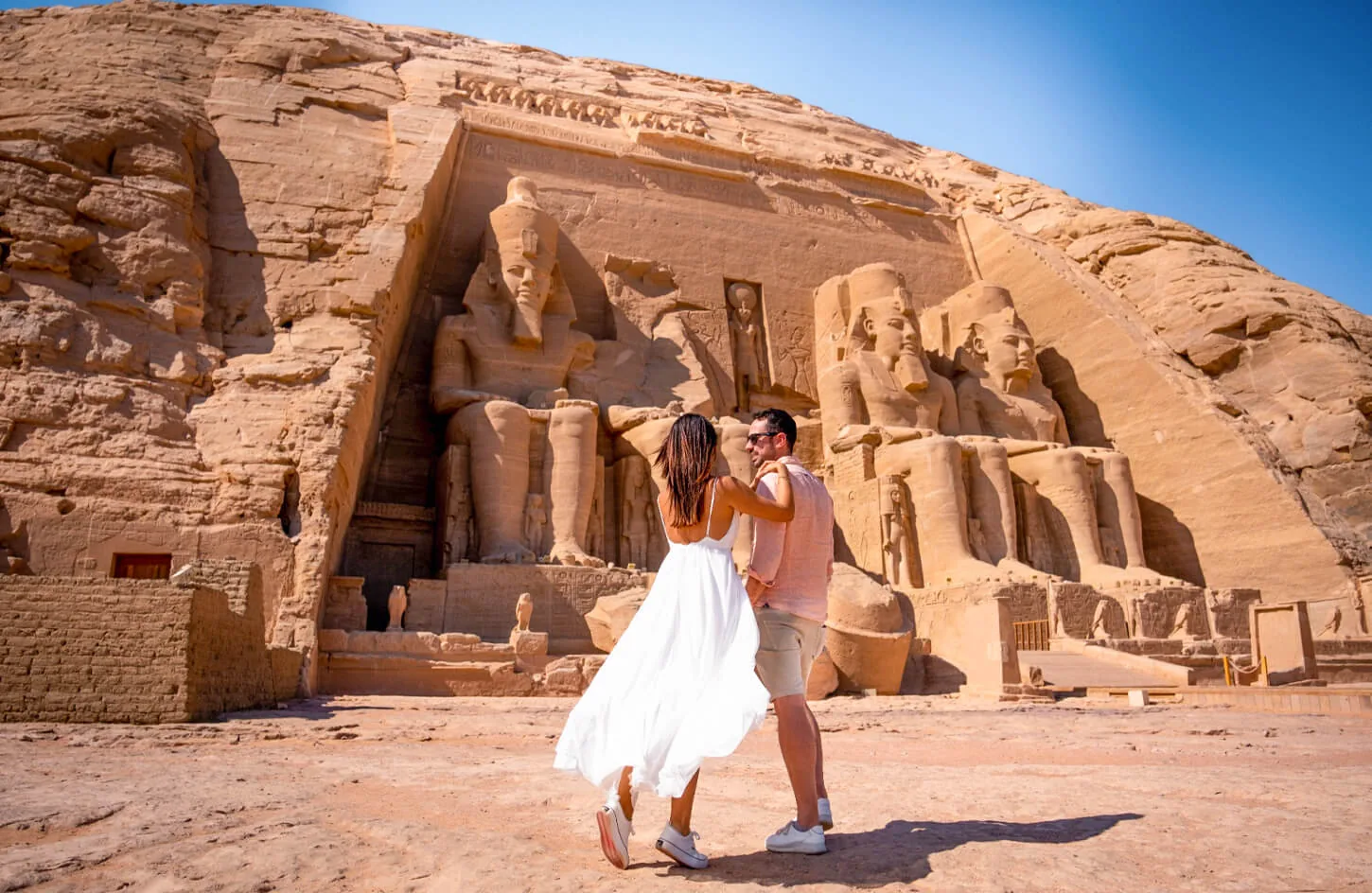A couple in front of abu simbel temple in aswan