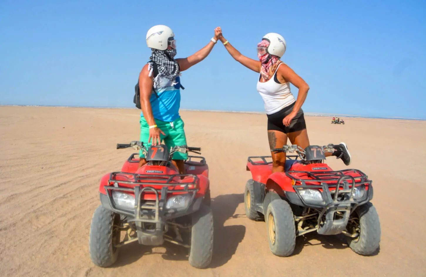 A tourist couple on a quad bike in the marsa alam desert
