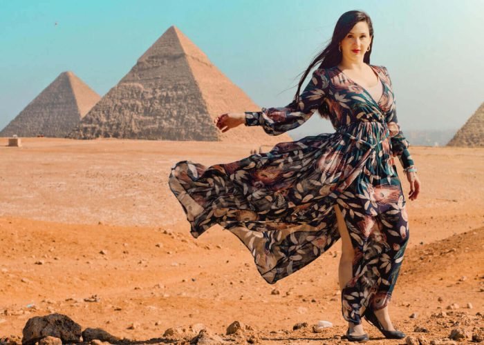 a-wonderful-shot-of-a-tourist-in-front-of-the-pyramids