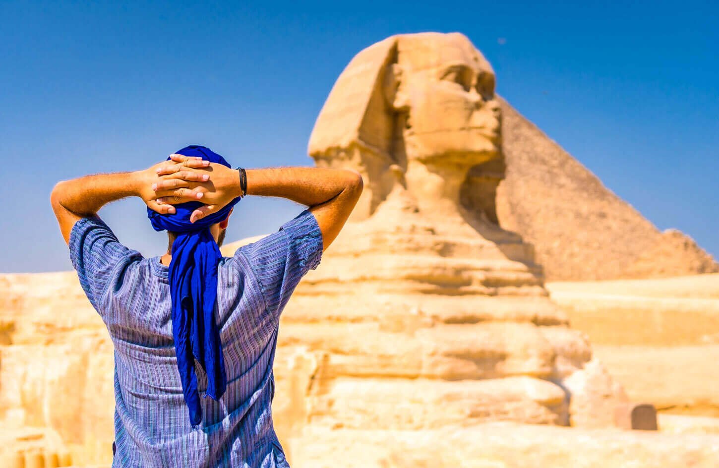 young-tourist-wearing-blue-turban-standing-near-great-sphinx-giza-cairo-egypt